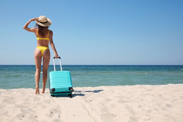 Woman packing light for a solo island getaway to Bahamas